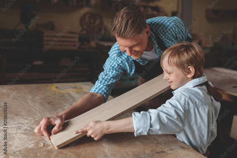 Smiling family in the workshop