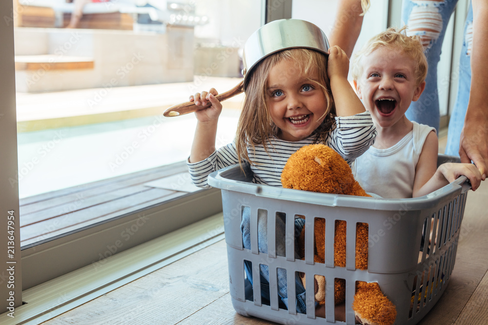 Kids rides in a laundry basket