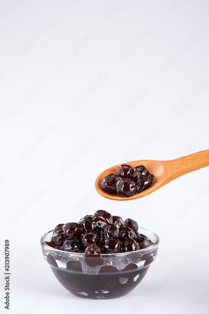  black pearls. Boiled tapioca pearls for bubble tea on white background. Copy space