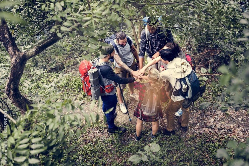 Trekking together in a forest