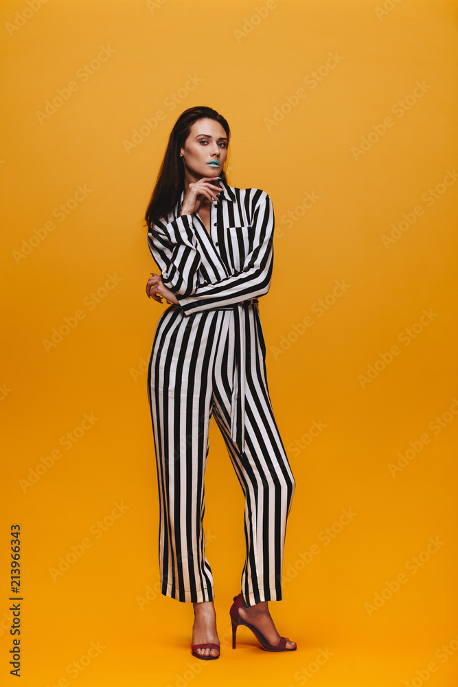 Attractive woman in striped jumpsuit