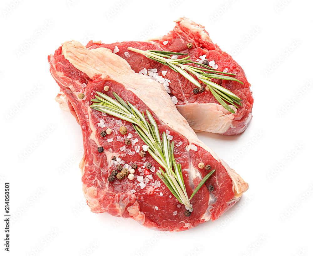 Raw meat with rosemary and spices on white background