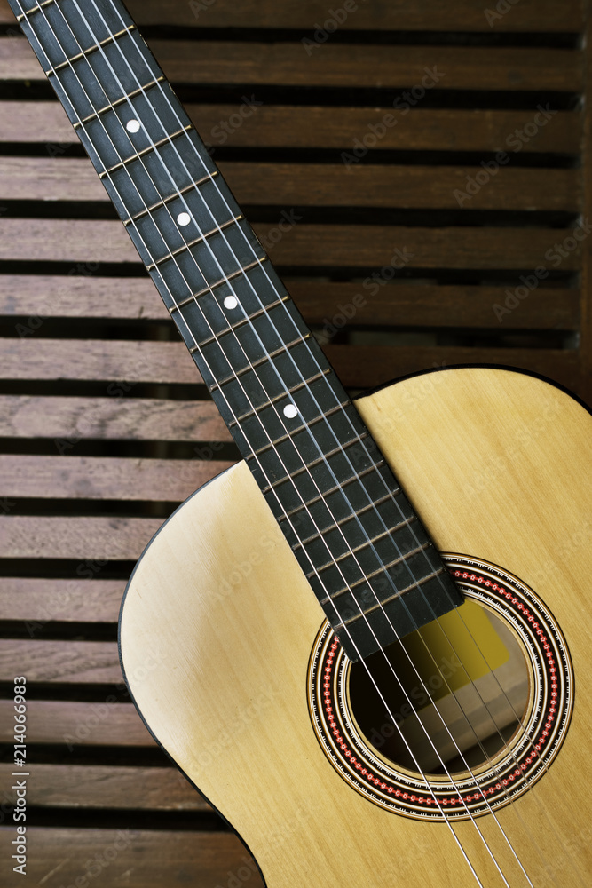 Acoustic guitar on a wooden floor