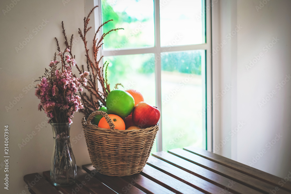 fruits and flower put on the table in coffee shop.