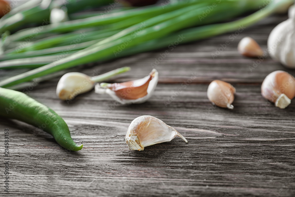 Fresh garlic on wooden background