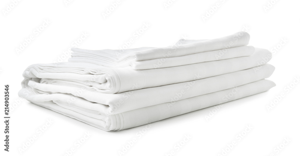 Stack of clean bed sheets on white background