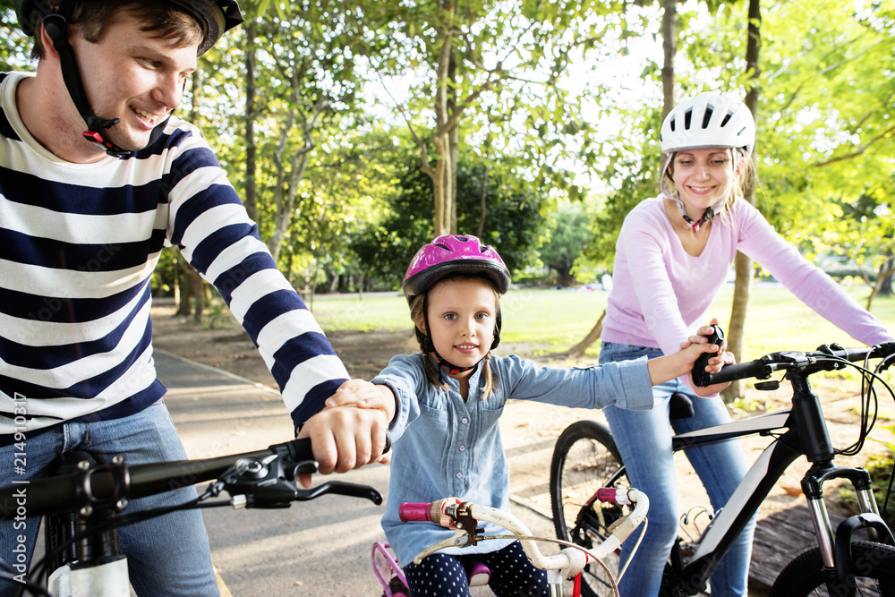 Family on a bike ride in the park