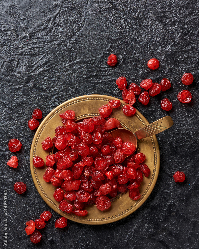 Dried red cherries on a plate. Top view.