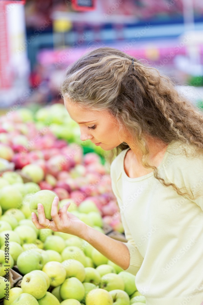 Portrait of a Woman Buying Fruits in a Supermarket