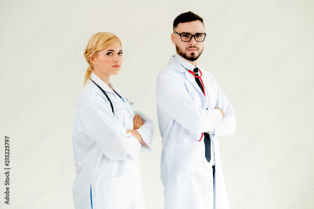 Confident doctors standing with arms crossed.