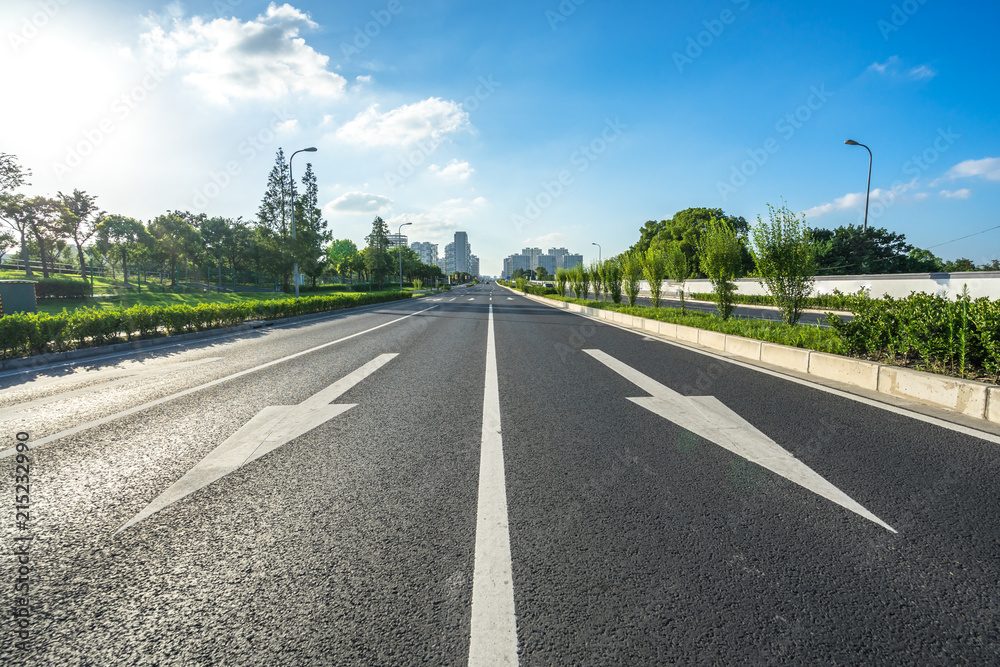 city skyline with asphalt road in urban