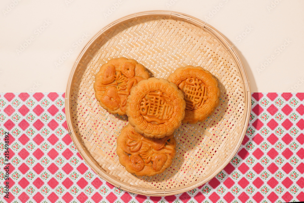 Delicious homemade mooncake of Vietnam cuisine culture. Text on cake mean happiness.