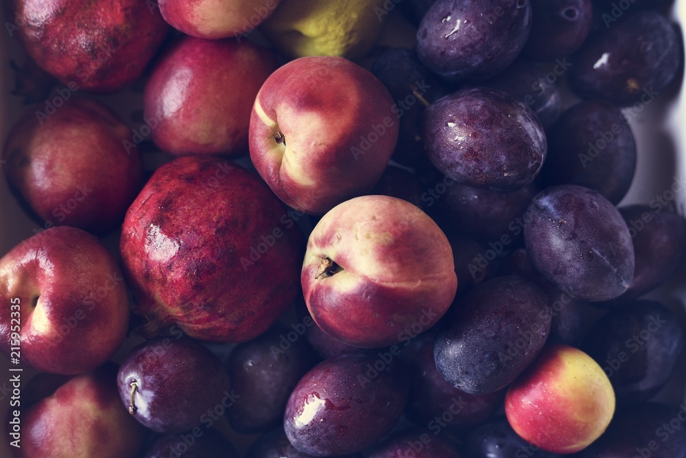 Closeup of plums and other fruits