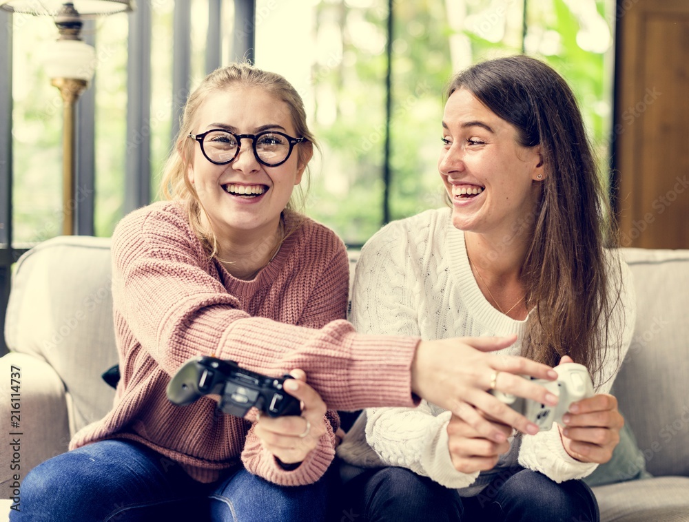 Women playing video game together