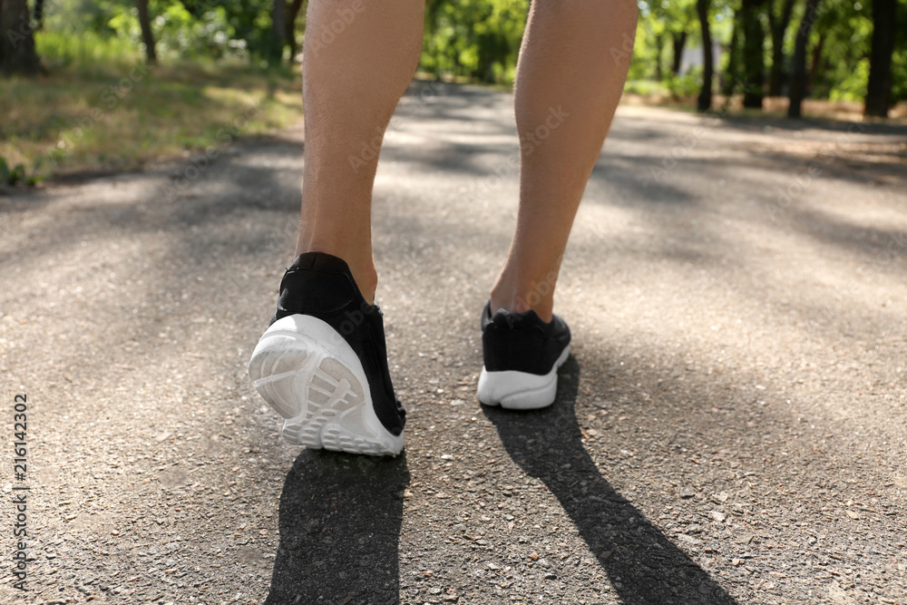 Sporty man running in park