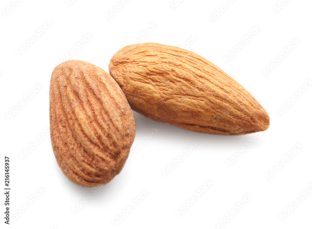 Tasty almonds on white background