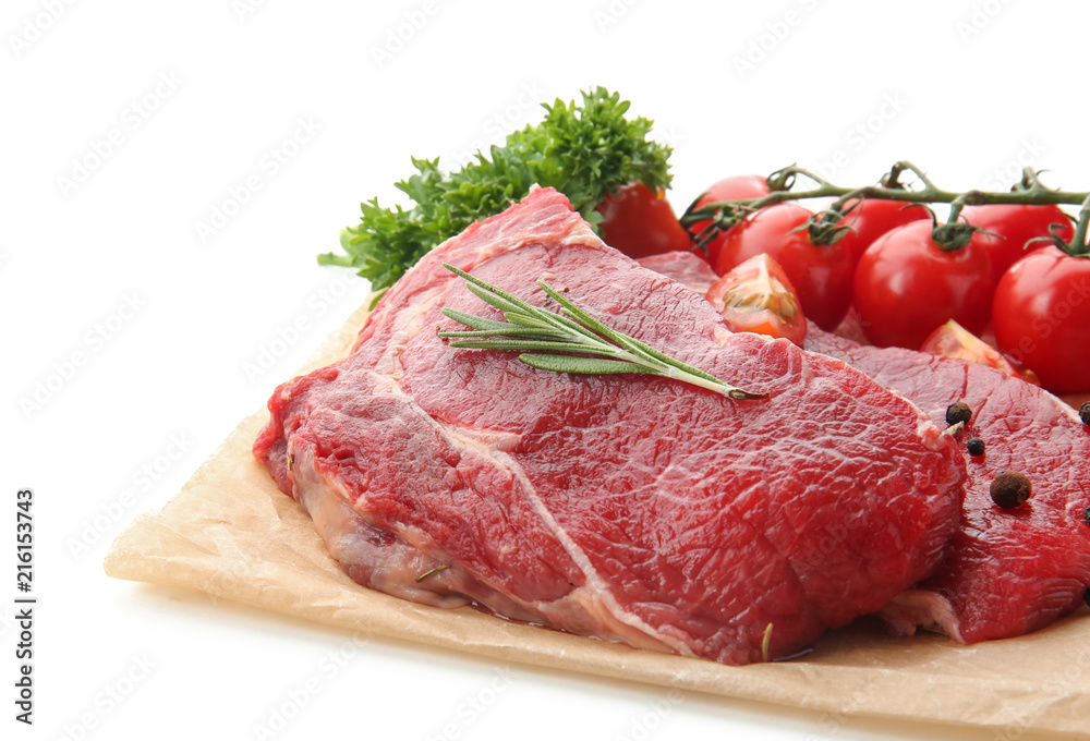 Fresh raw meat with spices, herbs tomatoes on white background