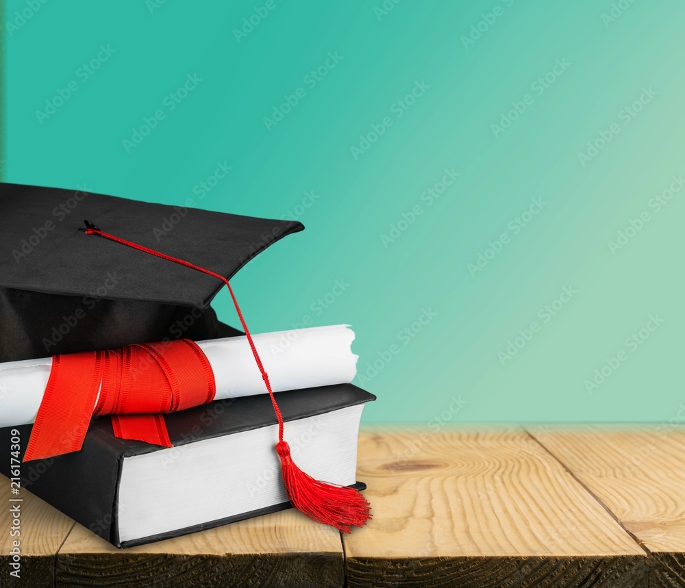 Graduation cap with books  and Degree