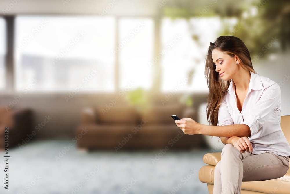 Portrait of a young businesswoman with phone