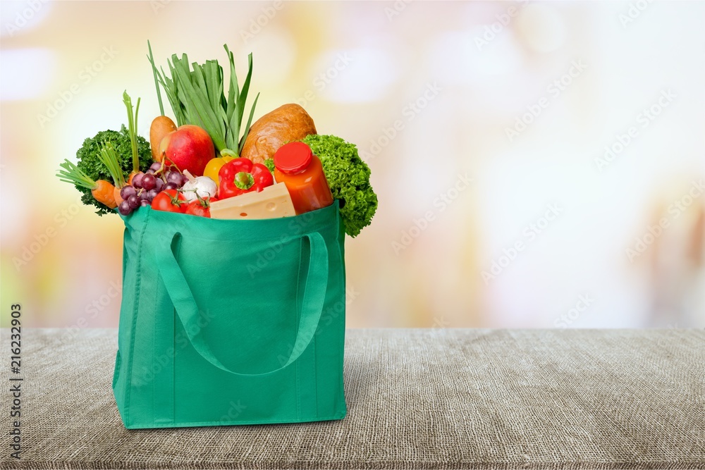 Full shopping  bag on desk