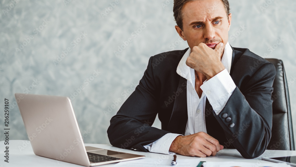 Stressed business man working in office