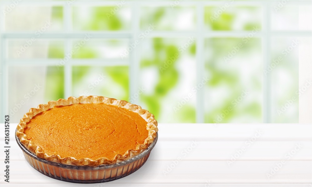 Home made pumpkin pie on white desk