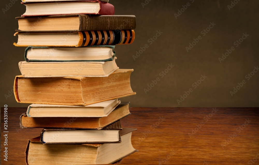 Books collection in pile on background