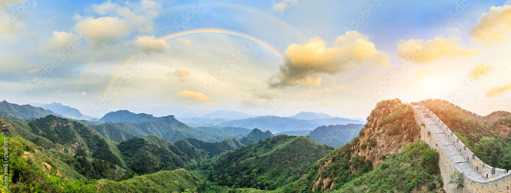 Majestic Great Wall of China and beautiful rainbow at sunset