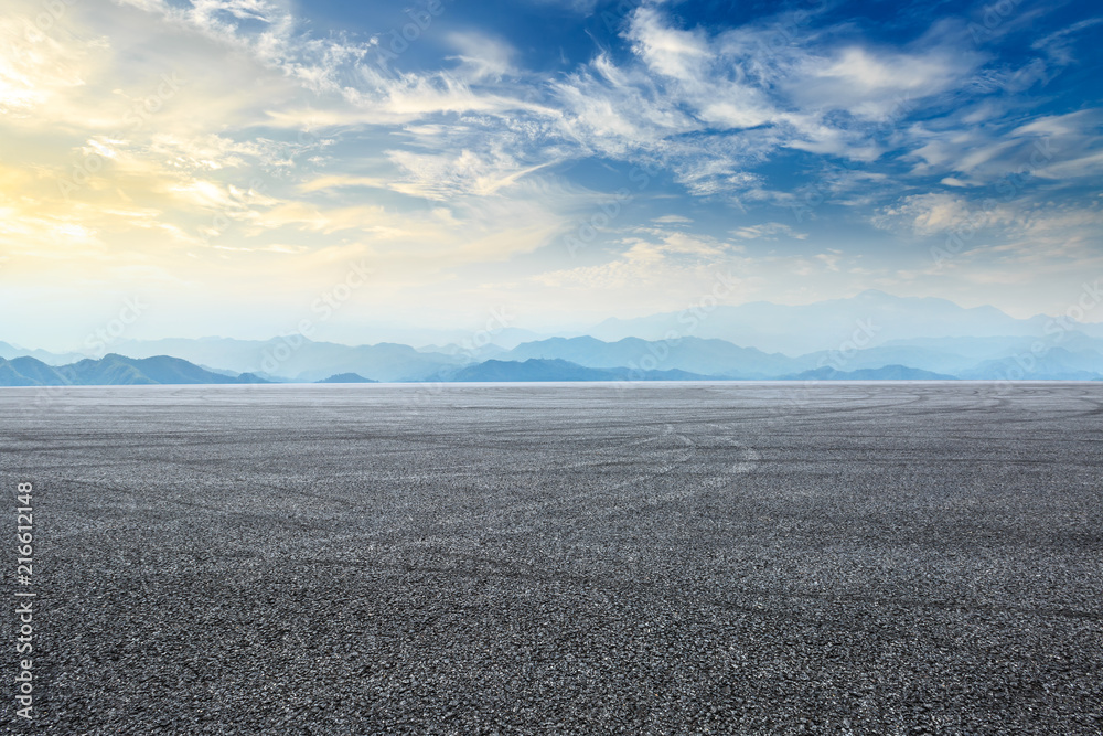 Empty asphalt square and mountain scenery at sunrise