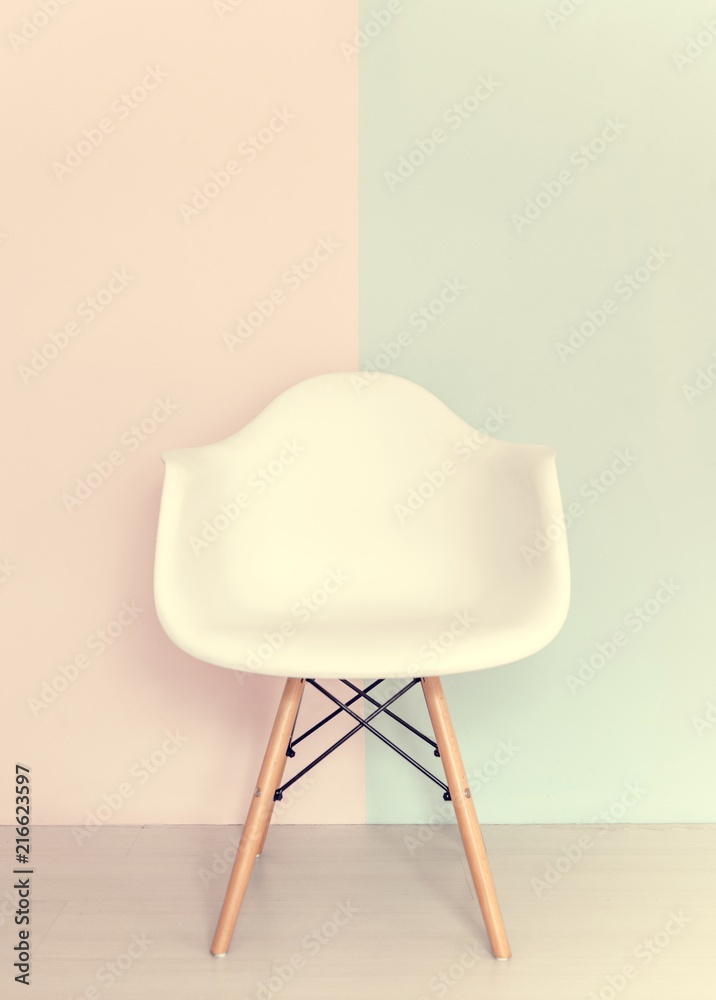 White chair on pastel background