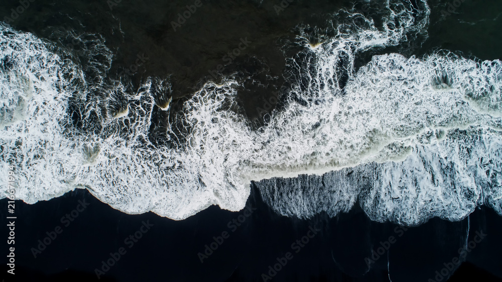 The black sand beach in Iceland. Sea aerial view and top view. Amazing nature, beautiful backgrounds