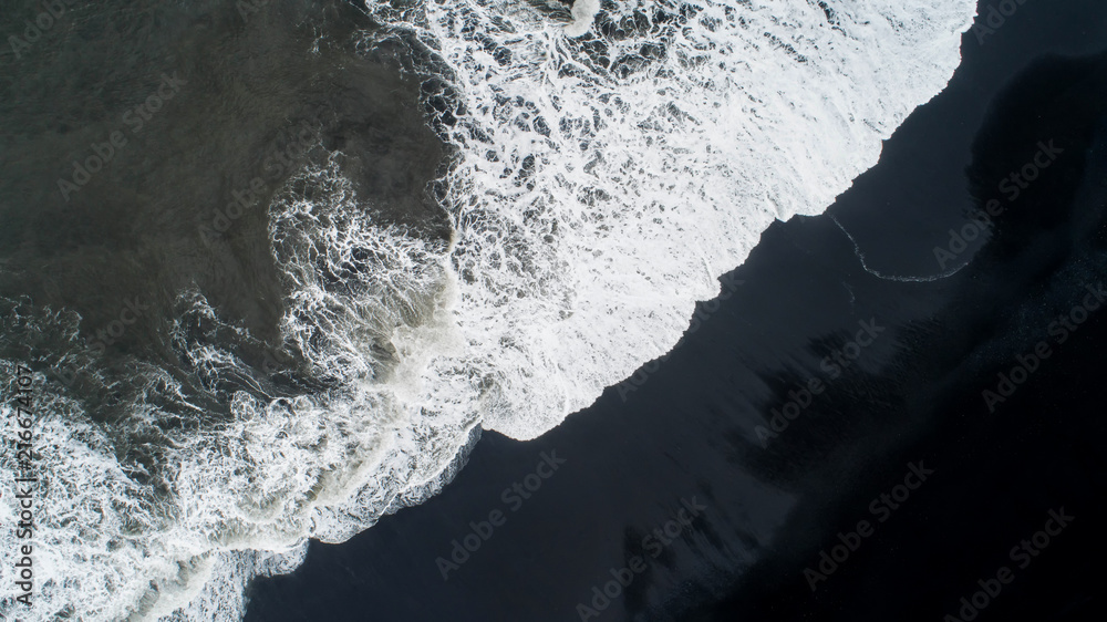 The black sand beach in Iceland. Sea aerial view and top view. Amazing nature, beautiful backgrounds