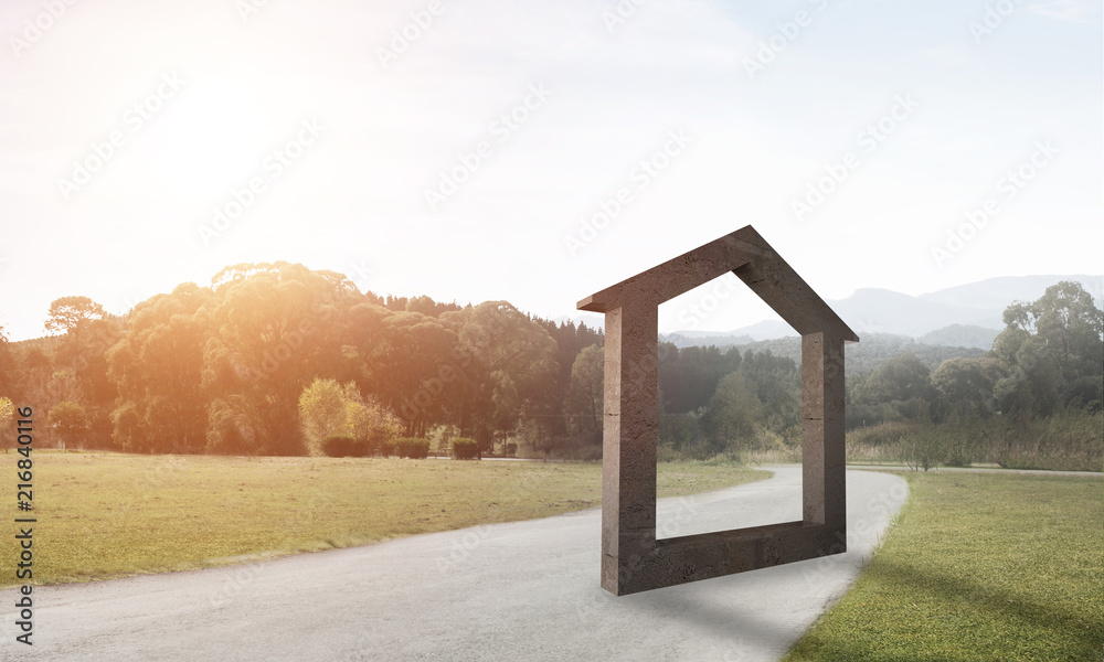 Conceptual background image of concrete home sign on asphalt road