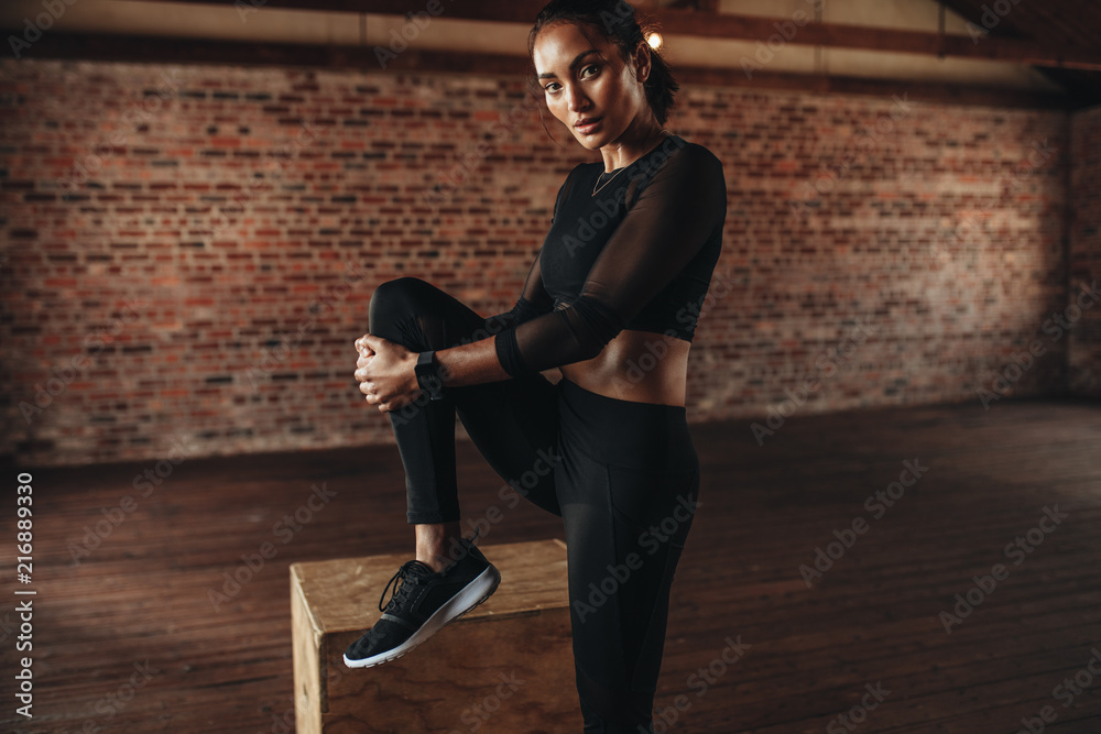 Woman working out at fitness studio