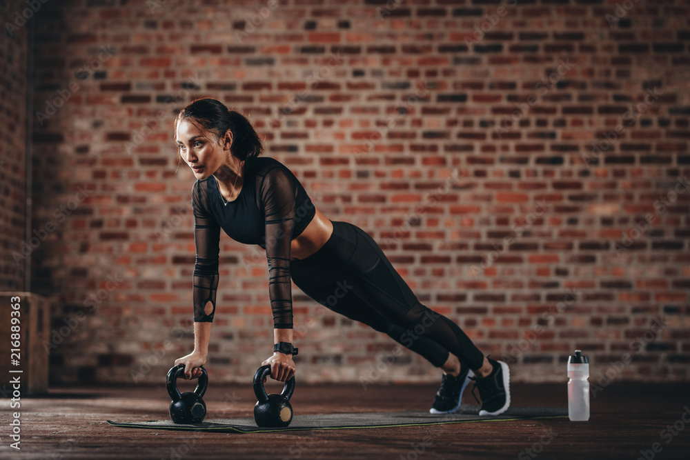 Woman working out at cross training gym