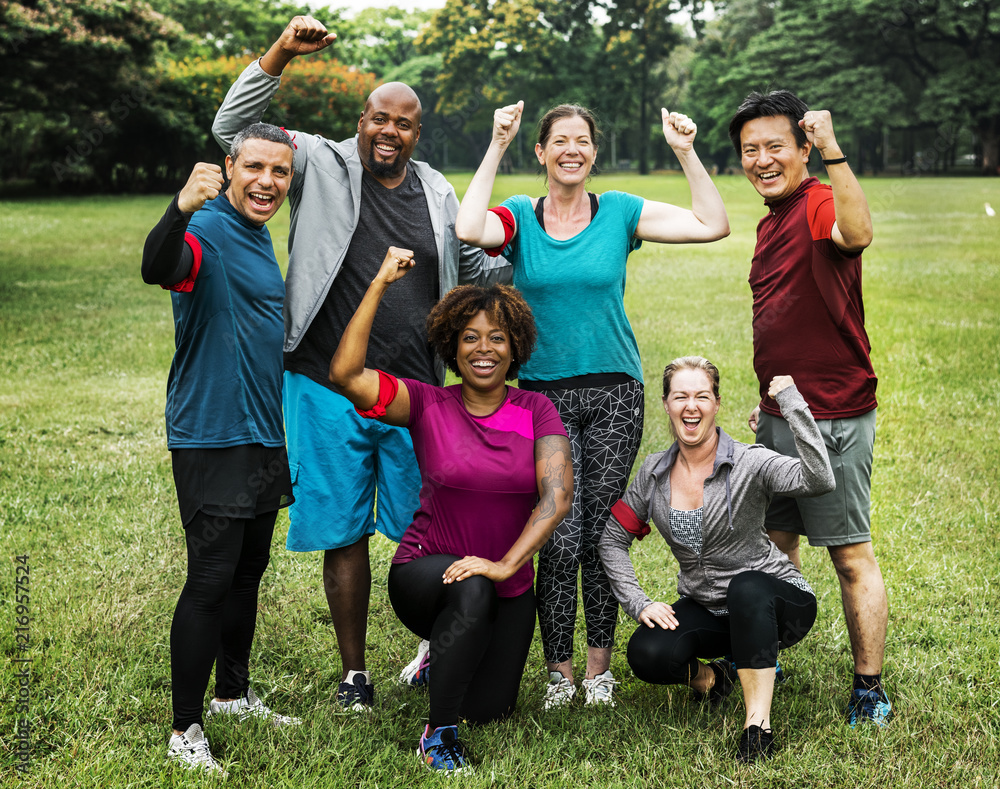 Group of cheerful diverse friends in the park