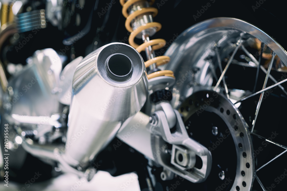 Closeup of exhaust or intake of racing motorcycle. Low angle photograph of motorcycle.