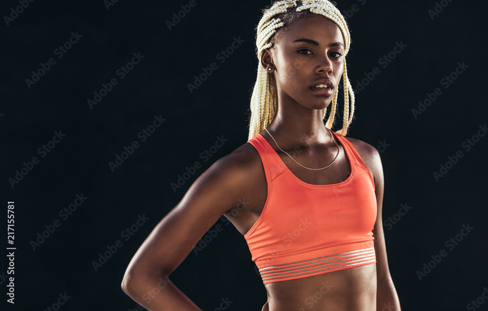 Portrait of a female athlete in fitness clothes