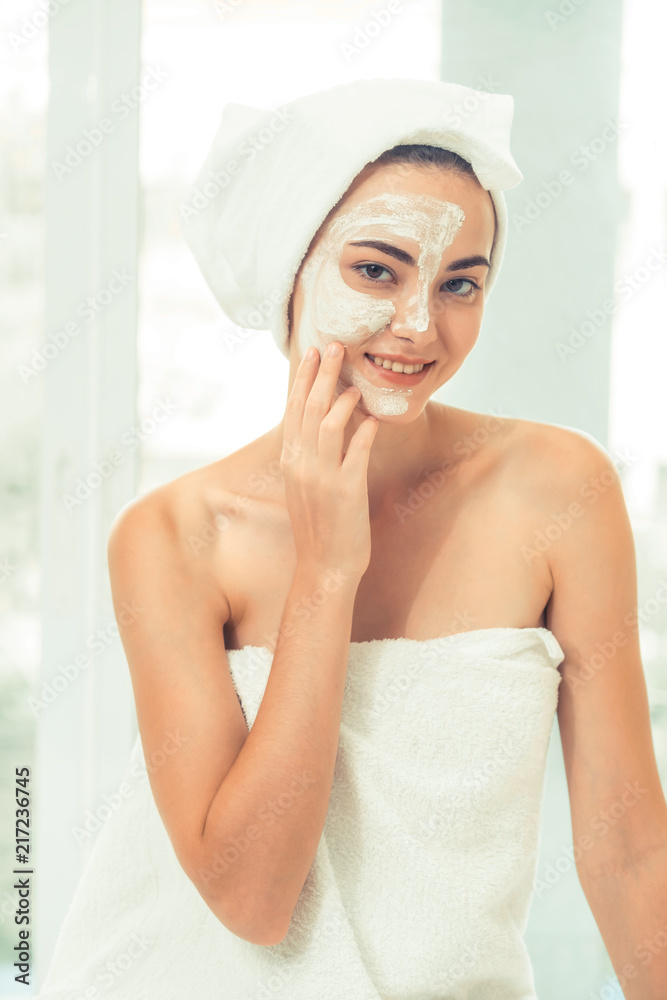 Beautiful woman having a facial treatment at spa.