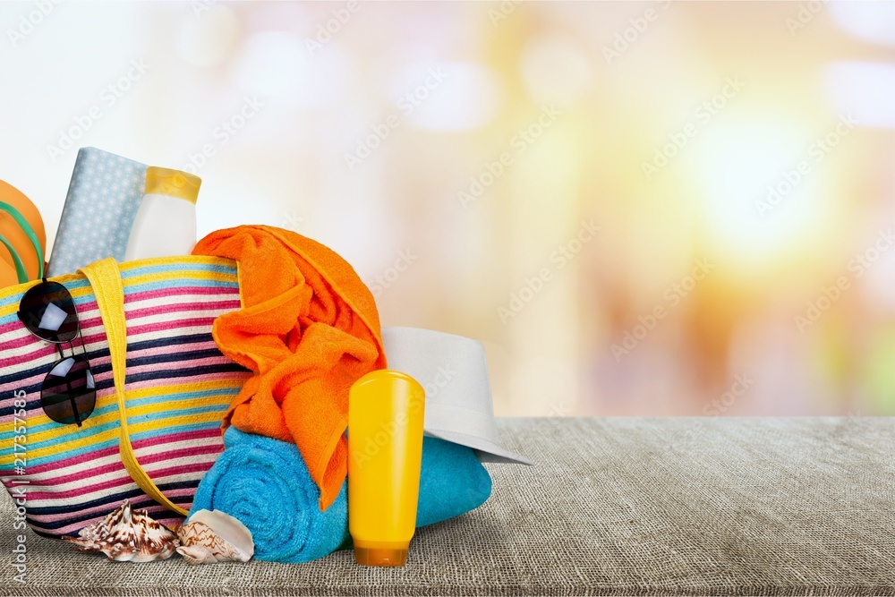 Colorful towels, cosmetics bottles and soap