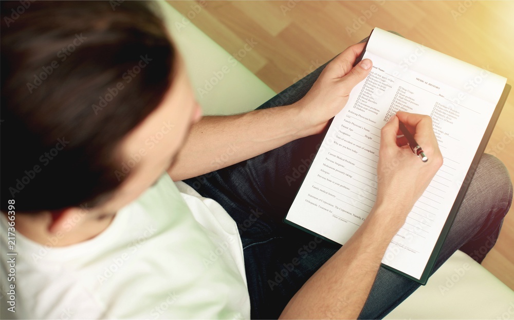 Hand writing in clipboard.