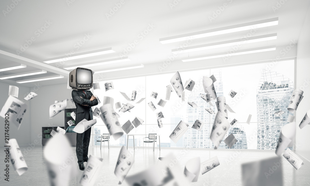 Businessman with an old TV instead of head.