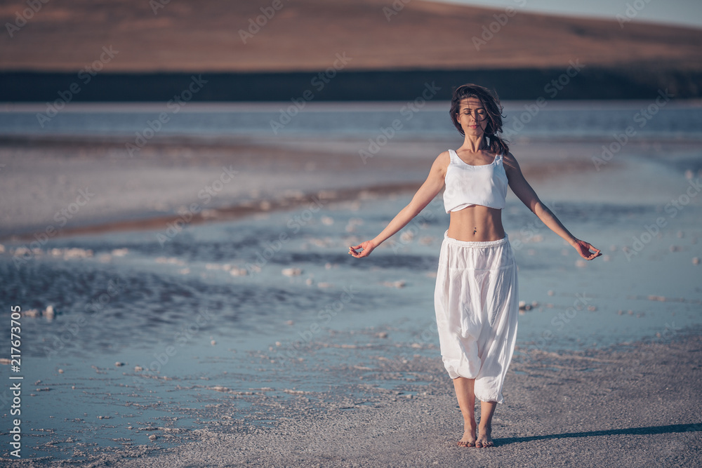 Asttractive woman doing yoga