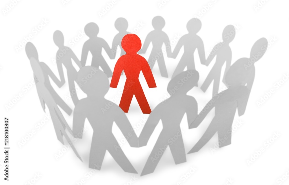 Paper People Standing in a Circle and One Red Paper Man Inside