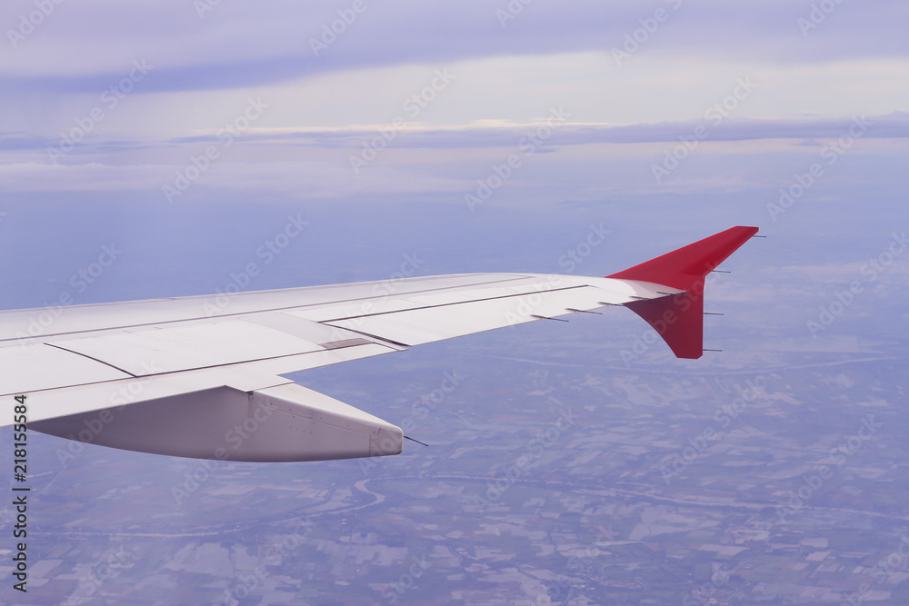 wing of airplane over the sky