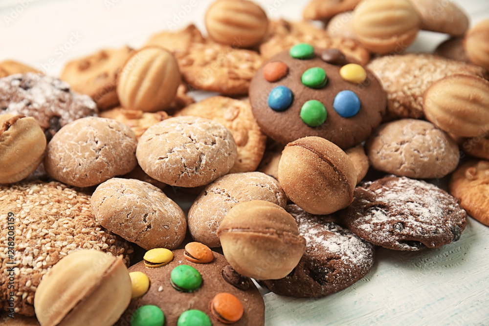 Different delicious cookies on white wooden table, closeup