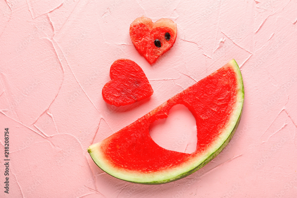 Creative composition with delicious sliced watermelon on color background