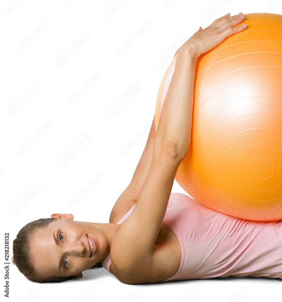 Young beautiful sporty woman  with fitness ball