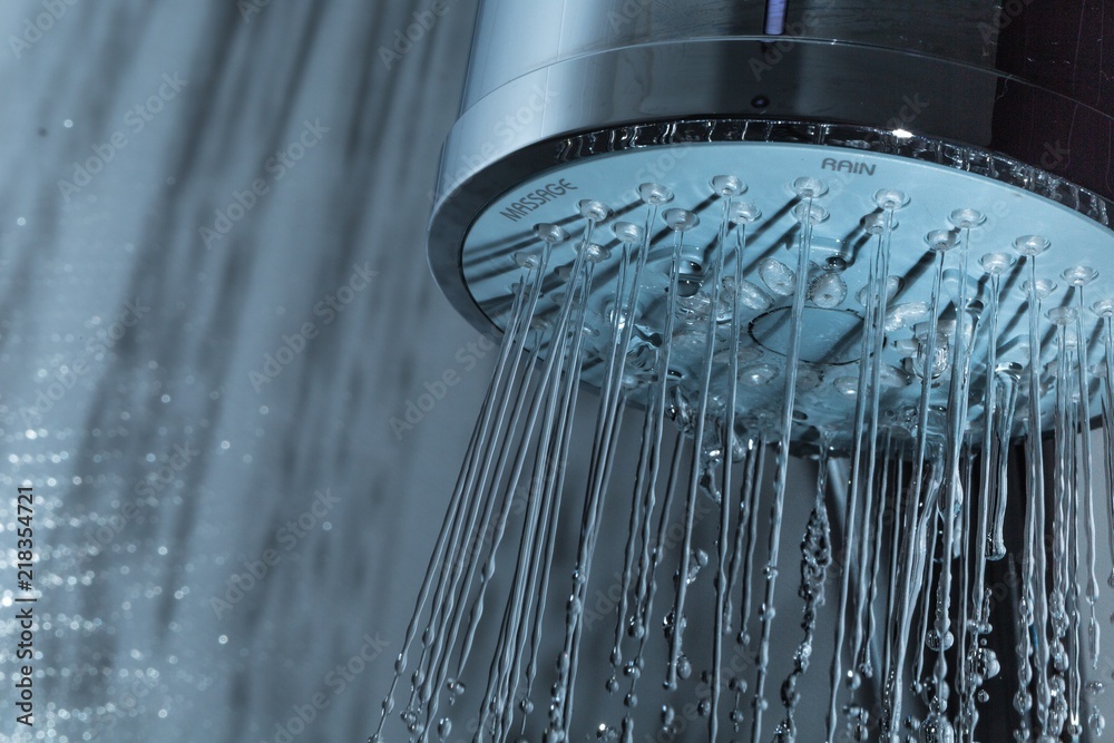 Shower Head with Water Stream on Grey Background