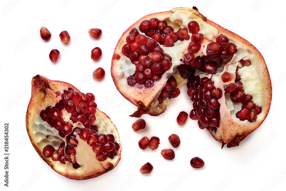 Pomegranate and seeds isolated on white background from top view